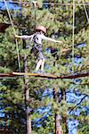 little boy being active at treetop adventure park