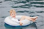 little boy enjoying swimming pool and vacation