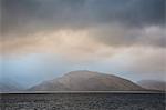 Stormy sky over craggy mountains and bay, Port Appin, Argyll Scotland