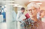 Portrait smiling senior businesswoman in office