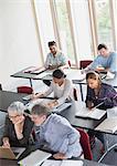 Students studying in adult education classroom