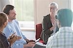 Smiling business people talking in meeting