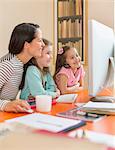 Mother and daughters using computer