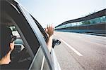 Woman travelling on highway, Garda, Italy