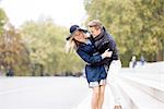 Romantic young couple fooling around in park, London, England, UK