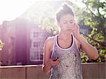 Young woman listening with earphones