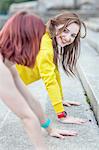 Young woman doing push-ups on steps