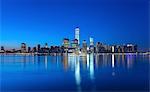 Manhattan financial district skyline and One World Trade Centre at night, New York, USA