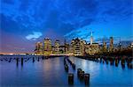 Manhattan financial district skyline and One World Trade Centre at dusk, New York, USA