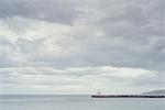 Distant view of harbour wall, Cumbria, UK