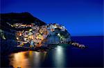 Waterfront cliff town of Manorola at night, Italy