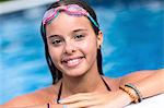 Teenager smiling in swimming pool