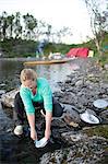 Woman washing dishes outdoor