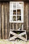 Bench near wooden house