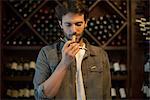 Sommelier smelling wine cork