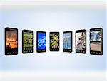 Modern mobile phones with different images isolated