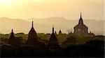Sunset scenic view with silhouettes of temples in Bagan, Myanmar (Burma)