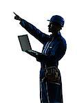 one  man construction worker computing computer silhouette portrait in studio on white background