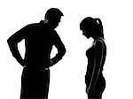 one man and teenager girl dispute conflict in silhouette indoors isolated on white background