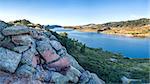 aerial panorama of southern part of the Horsetooth Reservoir near Fort Collins, Colorado, late summer scenery with a rock cliffs in foreground