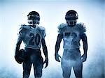 one american football players portrait in silhouette shadow on white background