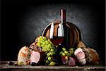 Wine and food on a black background