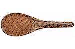 gluten free kaniwa (baby quinoa) grain on a wooden spoon isolated on white