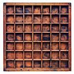 vintage wood  printer  (typesetter) drawer or shadow box with numerous dividers, isolated on white