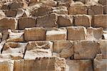 Brown stony wall of egyptian pyramid closeup