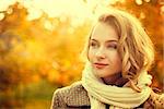Portrait of Young Fashion Woman Outdoor on Autumn Background. Toned Photo with Bokeh and Copy Space.