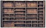 vintage wood  printer  (typesetter) drawer with numerous dividers, isolated on white