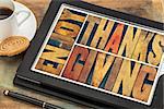 Enjoy  Thanksgiving  - greeting card or banner - isolated text in vintage letterpress wood type blocks on a digital tablet with cup of coffee