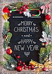 Chalk blackboard Christmas congratulation with Christmas decorations. Retro style. Christmas card.