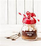 Hot chocolate mix with marshmallow in glass jar for christmas holiday drink.