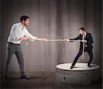 Big businessman pulls rope against small businessman