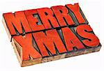 Merry Christmas  (Xmas) - isolated  word abstract in vintage letterpress wood type stained by red ink