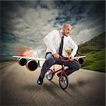 Businessman with bicycle with the aircraft turbines