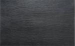 Black slate background or textured stony table close-up