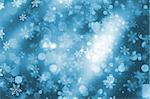 Christmas background of sparkling bokeh lights and snowflakes