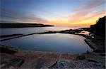 Malabar pool viewed from cliff above with a dawn sky just starting to colour up