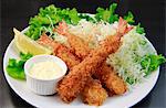 Fried prawns with salad