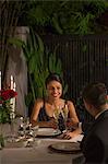 Singapore, Man and woman drinking champagne at romantic dinner