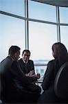 Singapore, Three business colleagues in discussion