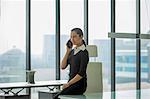 India, Woman in office talking on mobile phone