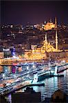 New Mosque (Yeni Cami) and Galata Bridge across Golden Horn at night seen from Galata Tower, Istanbul, Turkey, Europe