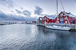 The typical fishing village of Henningsvaer with its red houses (rorbu), Lofoten Islands, Arctic, Northern Norway, Scandinavia, Europe