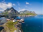 Breathtaking aerial view of scenic town Reine and surrounding fjords on Lofoten islands in Norway, famous tourist destination