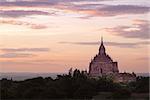 Scenic colorful sunset of ancient temple in Bagan with dramatic clouds, Myanmar