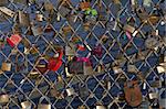 Love padlocks fixed at balustrade of Pont des Arts in Paris; France.