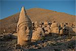 Some of the statues near the peak of Mount Nemrut (Turkey). West Terrace: head of Apollon and head of Goddess of Kommagene (Tyche). Scene in the sunset sun.